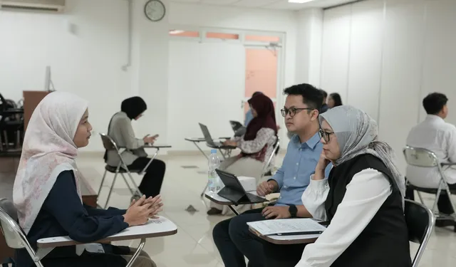 Students participate in scholarship selection and interview sessions in a hall